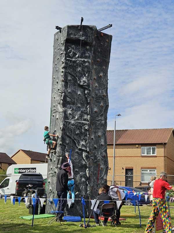 Children Climbing Tower At Fun Day