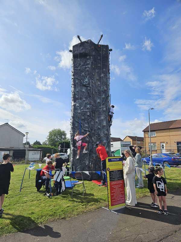 Children Climbing Up The Tower At Fun Day